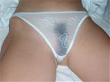 See through white panties exposing a hairy pussy.