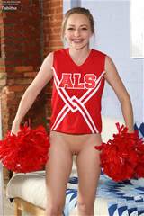 Cheerleader in red uniform and white panties demonstrates her shaved ...