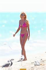 ... Silvstedt in pink bikini enjoys and relaxes in the sun at Miami Beach