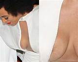 Solange Knowles in wide cleavage nip slip