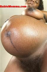Black pregnant woman with hairy bush and big tits