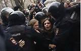 ... and Maria Alyokhina of Pussy Riot during their arrest in Moscow