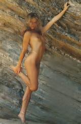 Marilyn Chambers naked against rocks