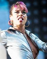 Lily Allen: topless side boobing in shiny silver outfit