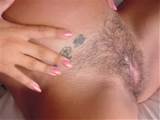 Horny pregnant Latina Nikki naked and spreading her legs wide to show ...