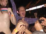 Girls Flashing in Concert Arena