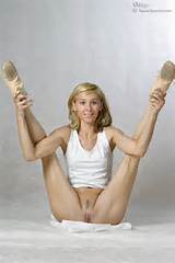 Naked gymnast doing her stretching workout