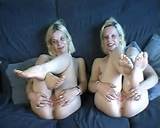 Smiling blonde haired twin sisters compare their tits and pink pussies